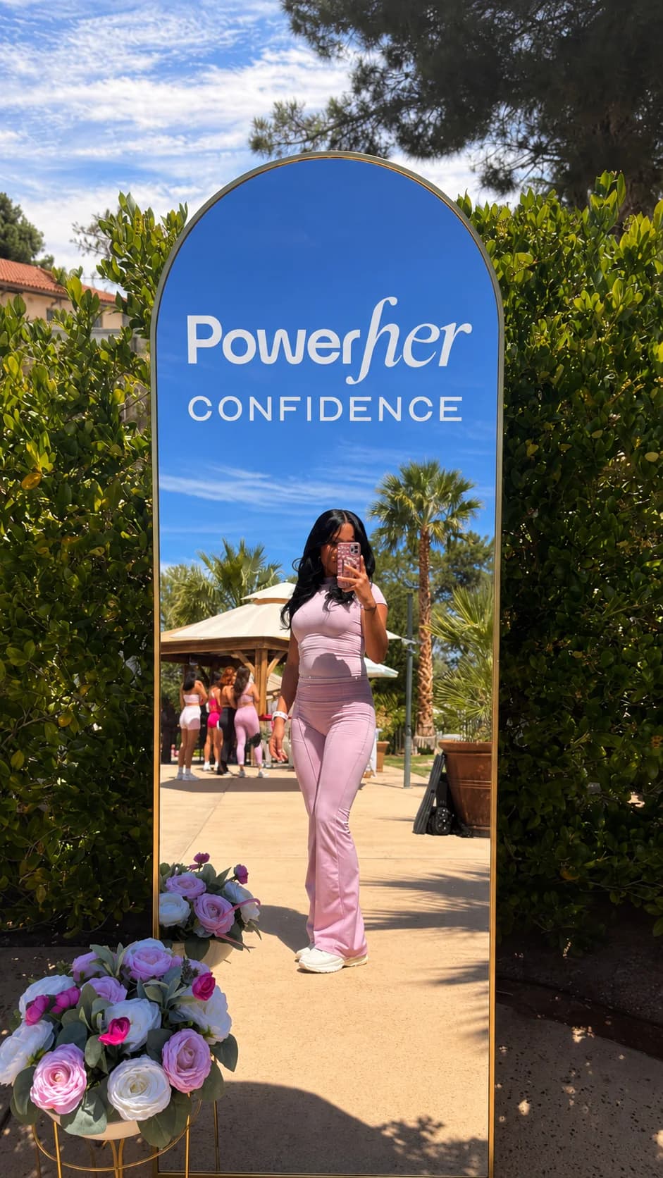 A PowerHER confidence mirror activation at an outdoor event